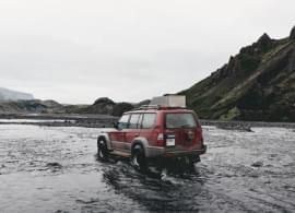jeep on the river