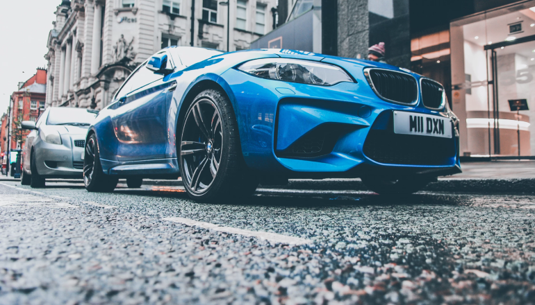 blue BMW car on the road