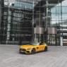 a yellow car near the office center